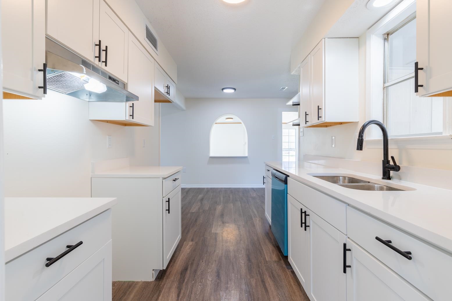 3268 Altruria Road Bartlett, TN 38134 - Photo 8 of 25 a kitchen with a sink cabinets and wooden floor