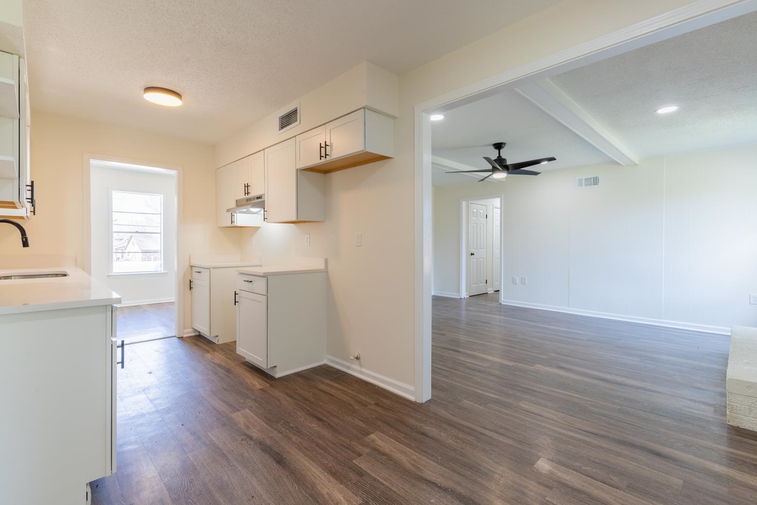 3268 Altruria Road Bartlett, TN 38134 - Photo 10 of 25 a view of a kitchen with wooden floor a sink and a window
