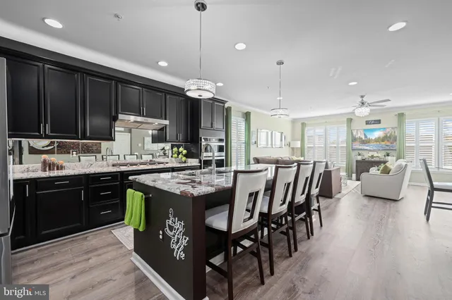 a living room with furniture and a dining room