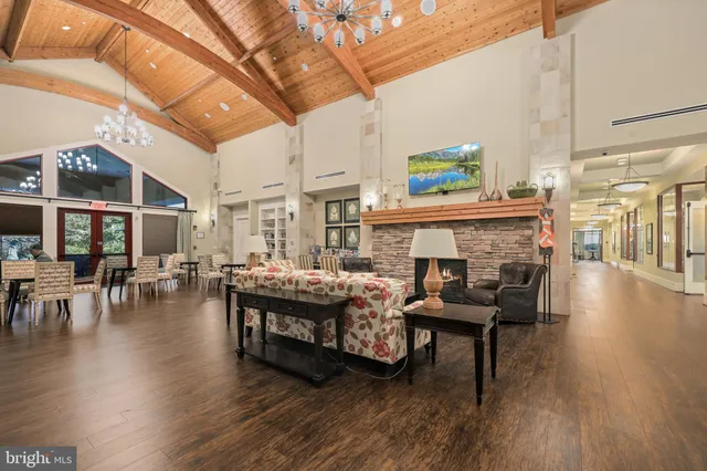 a view of a chair and table in the house front view of a house