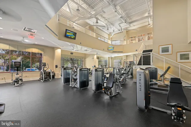 a kitchen with stainless steel appliances granite countertop a refrigerator and a stove