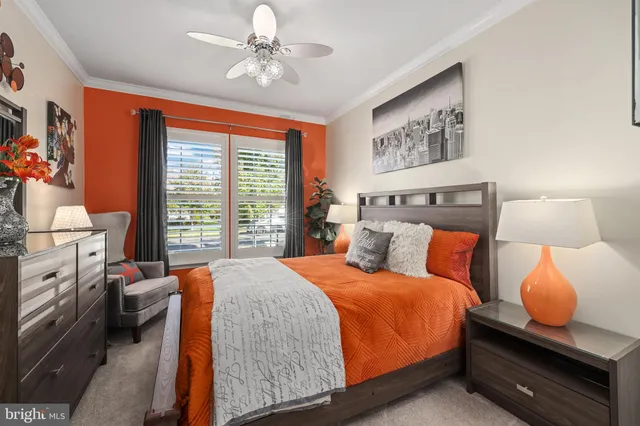 a kitchen with stainless steel appliances kitchen island granite countertop a table chairs and a refrigerator