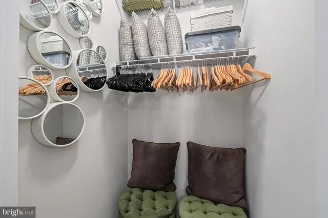 a kitchen with stainless steel appliances granite countertop a sink a stove and a wooden floors