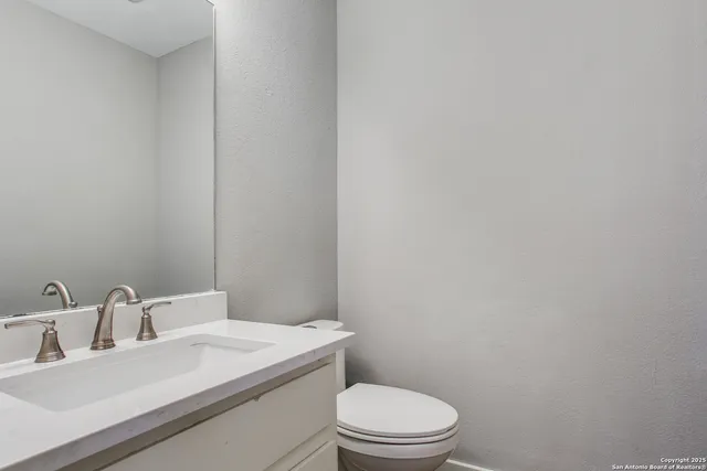 a bathroom with a sink a toilet