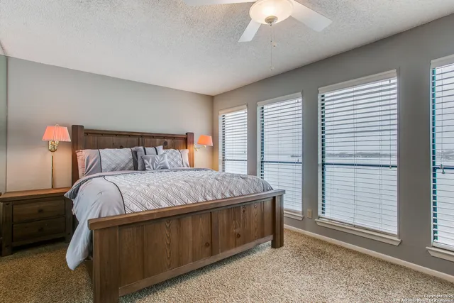 a bed sitting in a bedroom next to a window