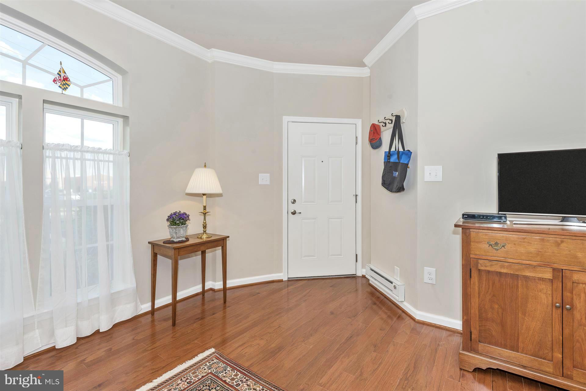 212 Mill Pond Road, Unit A Frederick, MD 21701 - Photo 14 of 29 a view of a livingroom with wooden floor and furniture
