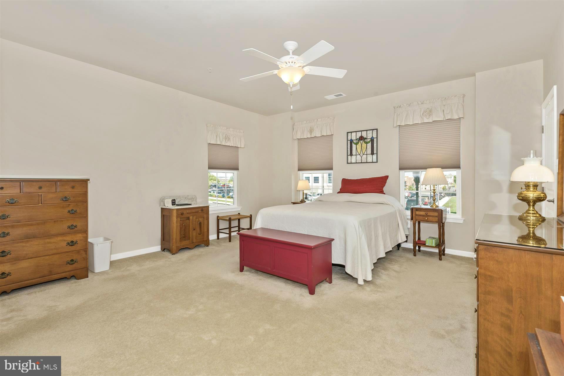 212 Mill Pond Road, Unit A Frederick, MD 21701 - Photo 22 of 29 a spacious bedroom with a bed and a cabinets