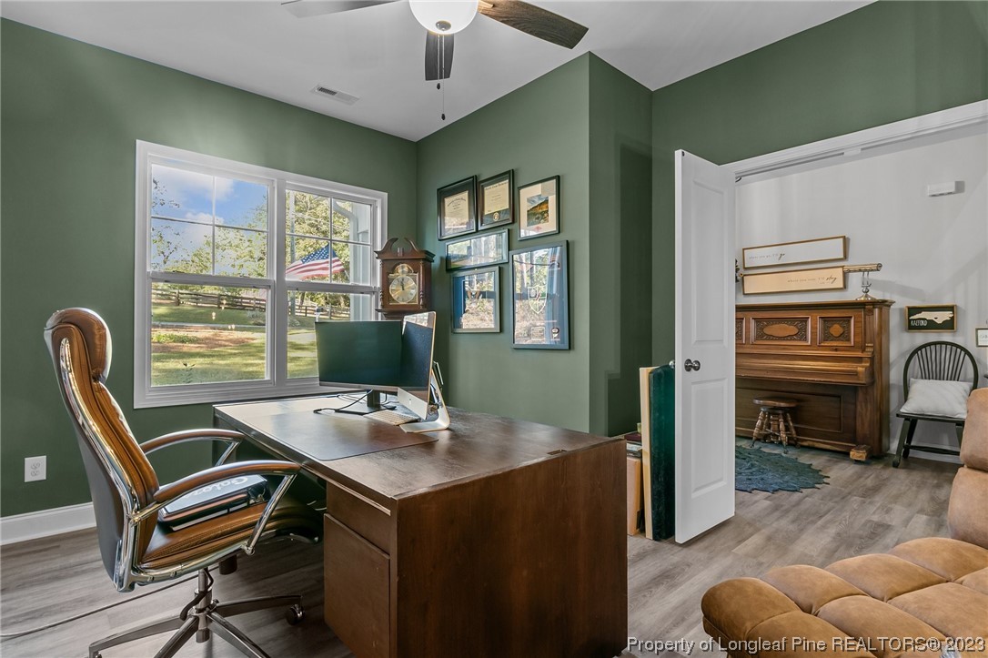 445 Myra Road Raeford, NC 28376 - Photo 8 of 45 a workspace with furniture and window