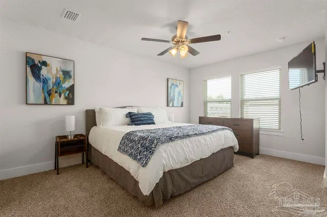 a bedroom with a bed and window