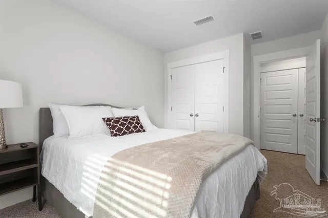 a bathroom with a toilet a sink and a mirror
