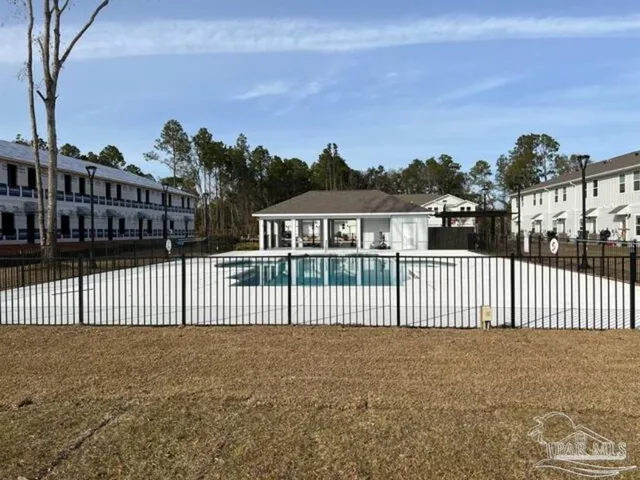 a view of a swimming pool with lounge chair