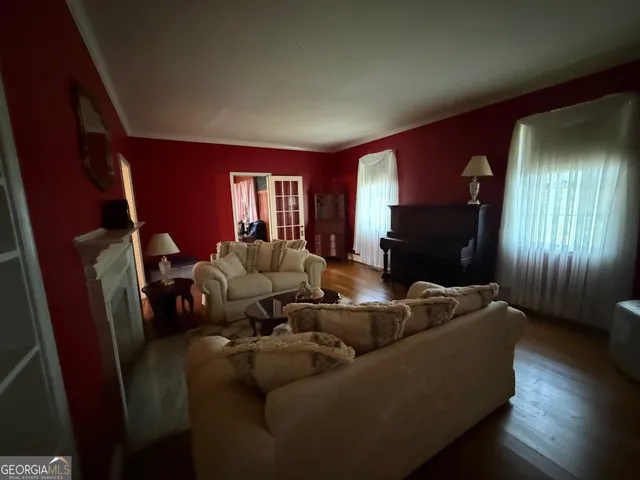 a living room with furniture window and a fireplace