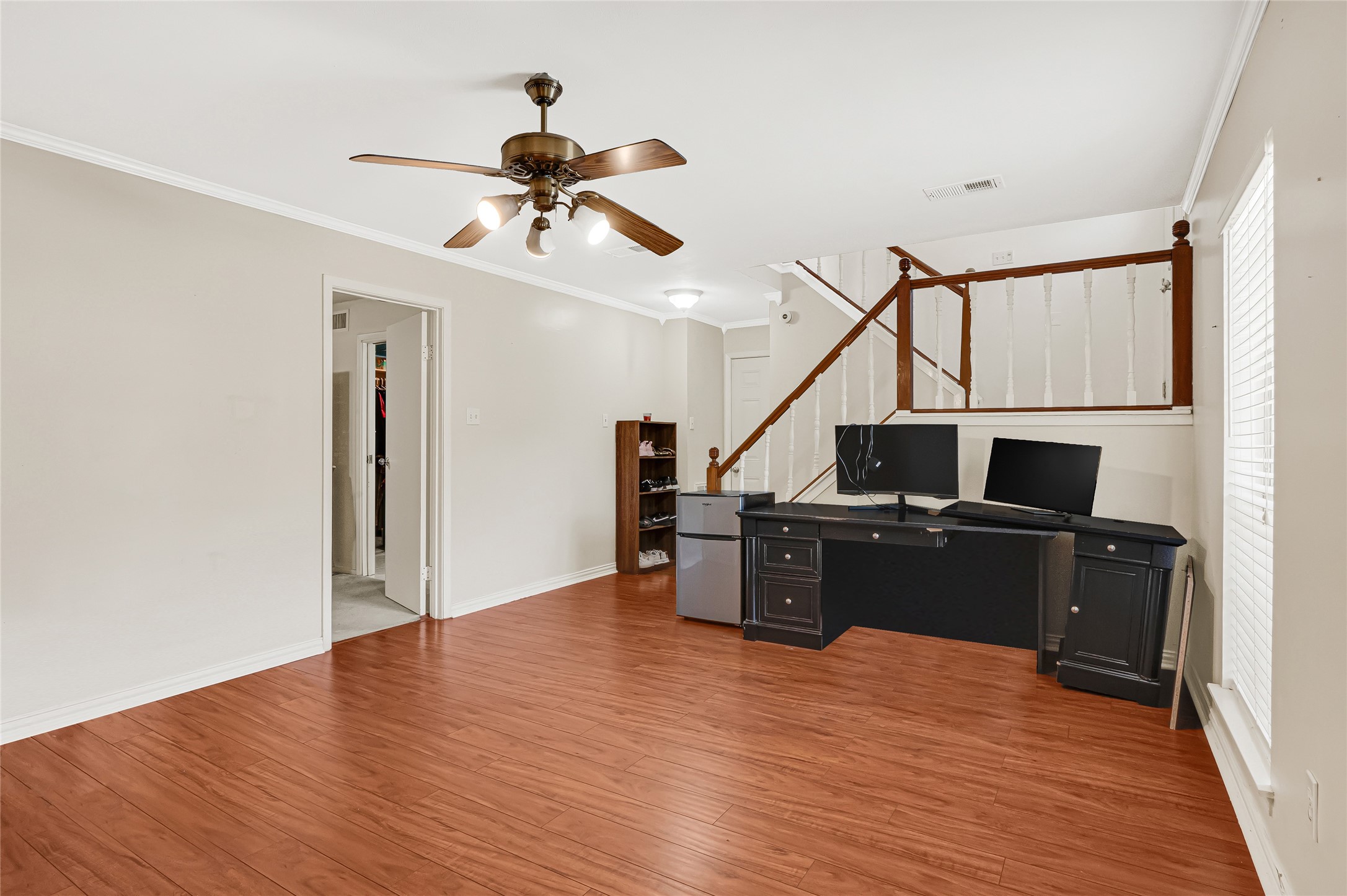 23419 Bayleaf Drive Spring, TX 77373 - Photo 17 of 23 Downstairs living area leading to primary bedroom and garage.