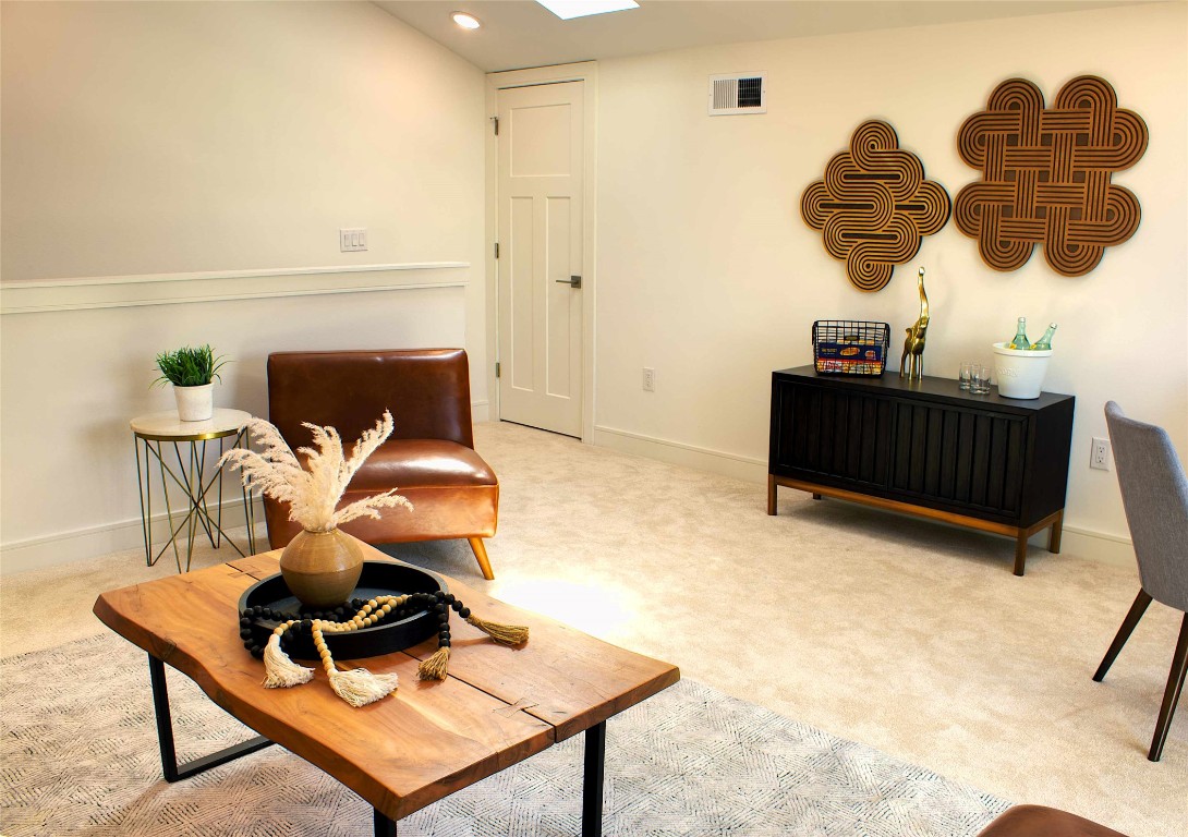 300 Tesla Circle Austin, TX 78681 - Photo 18 of 39 Living area with a skylight, carpet flooring, and recessed lighting