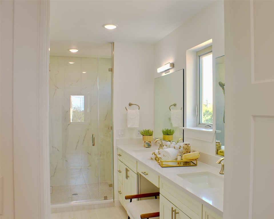 300 Tesla Circle Austin, TX 78681 - Photo 26 of 39 Full bath featuring a marble finish shower, double vanity, and recessed lighting