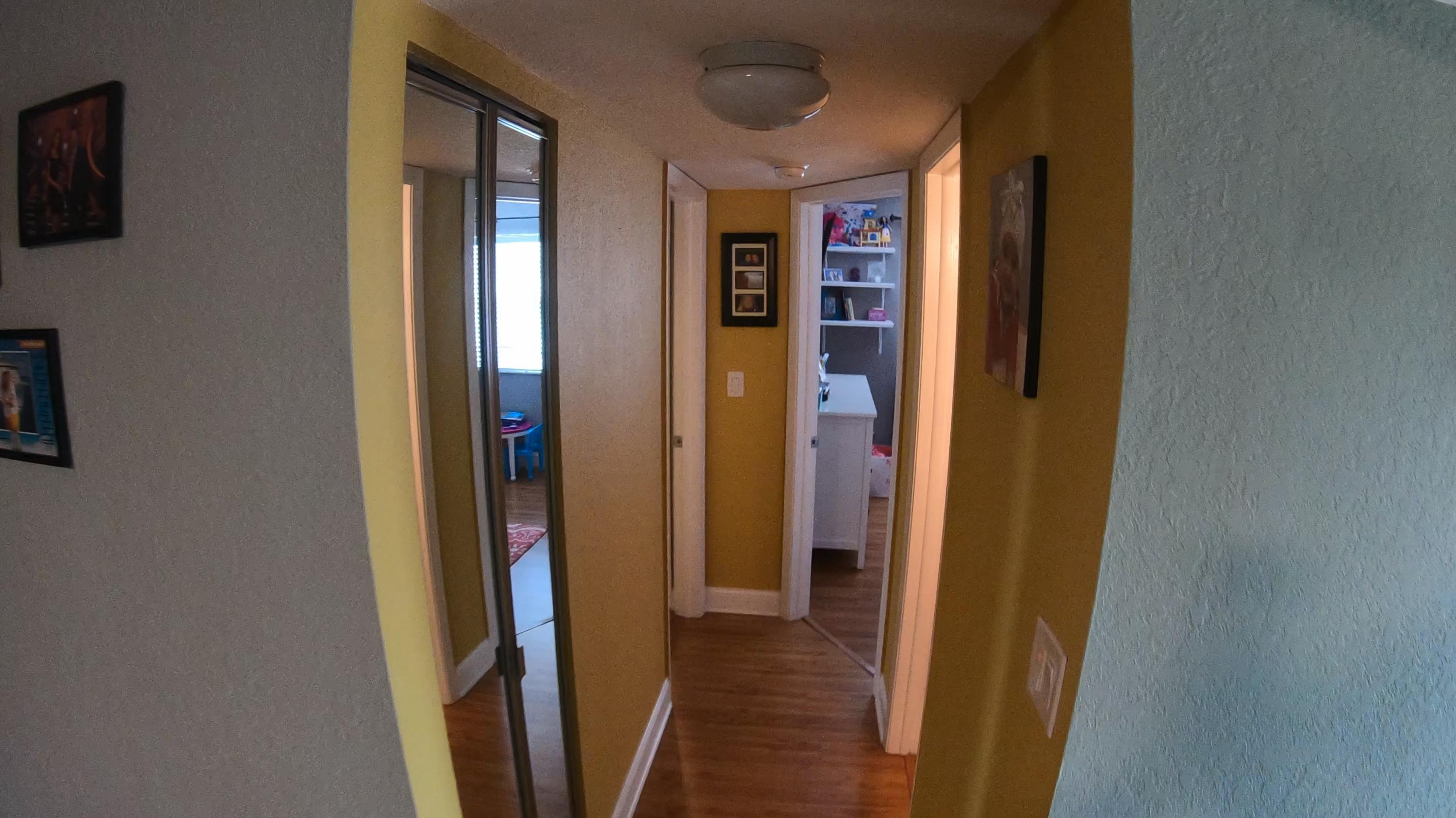 9273 Southwest 8th Street, Unit 312 Boca Raton, FL 33428 - Photo 12 of 57 bedroom hallway