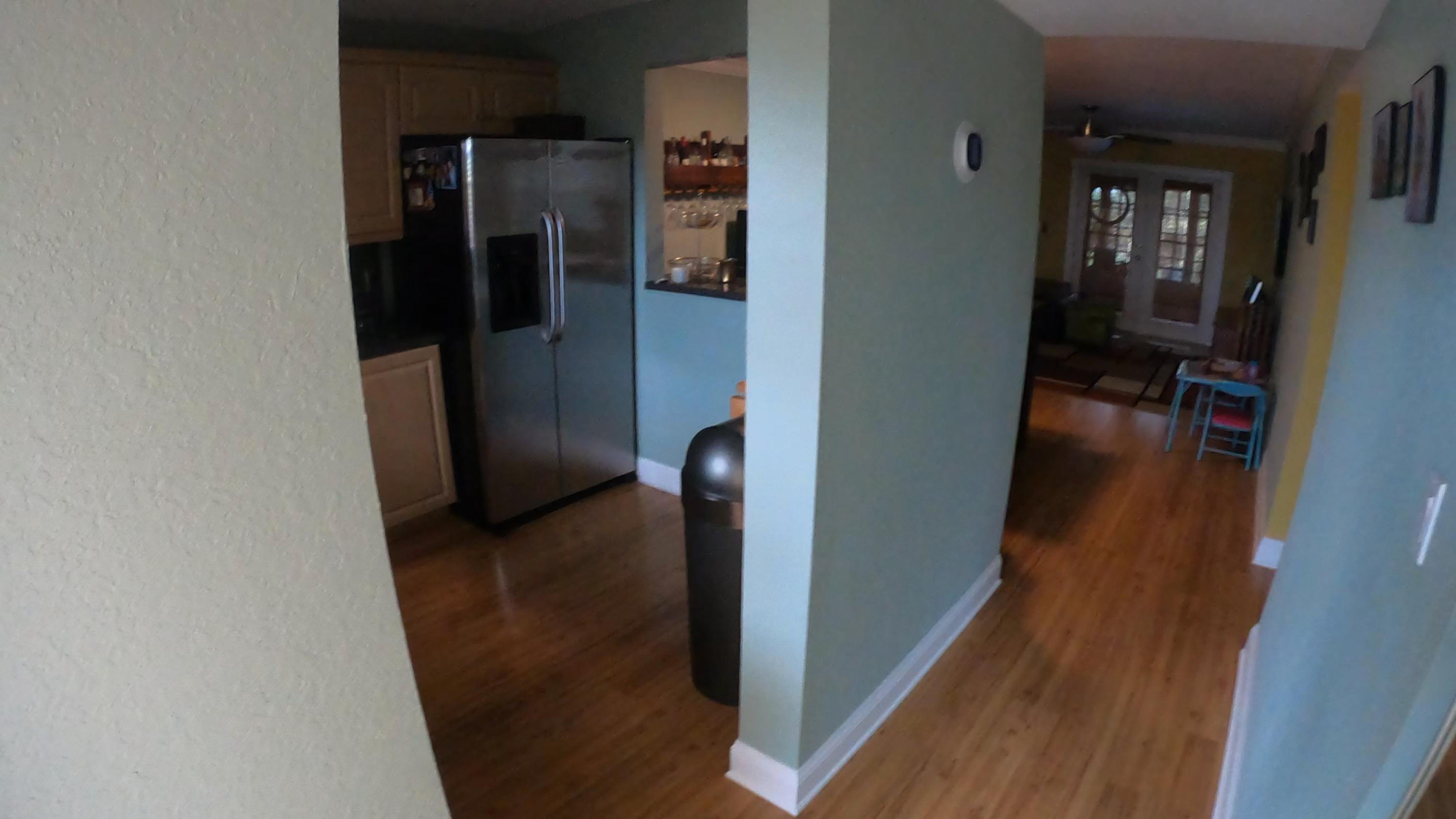 9273 Southwest 8th Street, Unit 312 Boca Raton, FL 33428 - Photo 4 of 57 kitchen and hallway