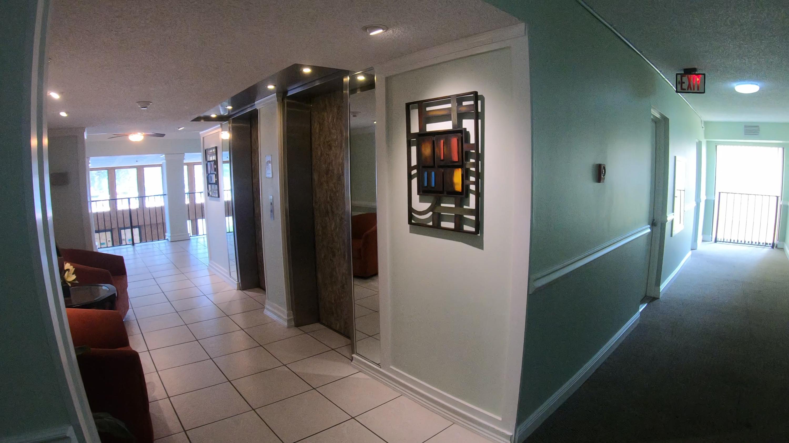 9273 Southwest 8th Street, Unit 312 Boca Raton, FL 33428 - Photo 48 of 57 lobby elevators