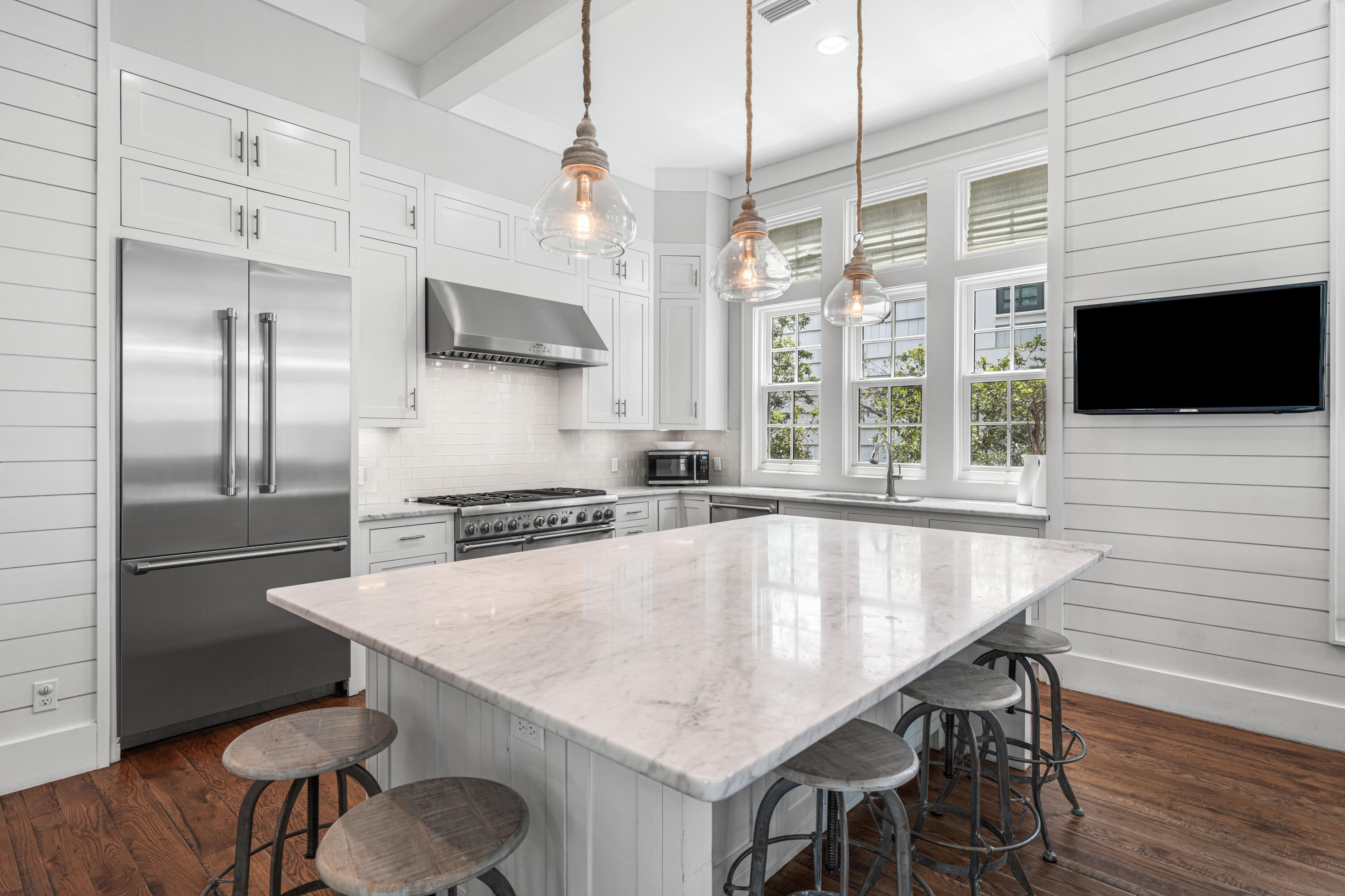 34 North Watch Tower Lane Inlet Beach, FL 32461 - Photo 13 of 90 a kitchen with stainless steel appliances granite countertop a kitchen island a stove a refrigerator a dining table and chairs