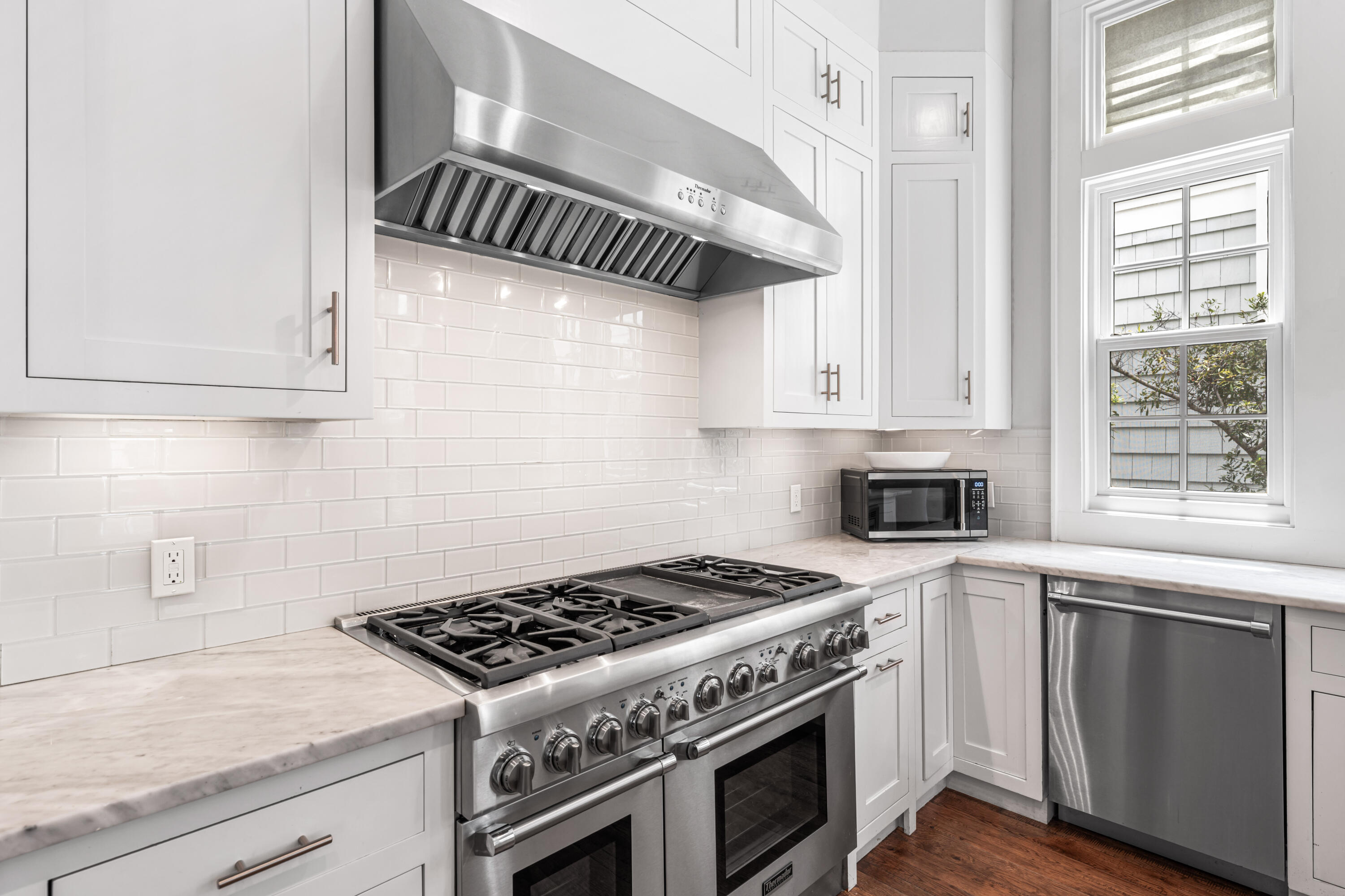 34 North Watch Tower Lane Inlet Beach, FL 32461 - Photo 17 of 90 a kitchen with white cabinets and appliances