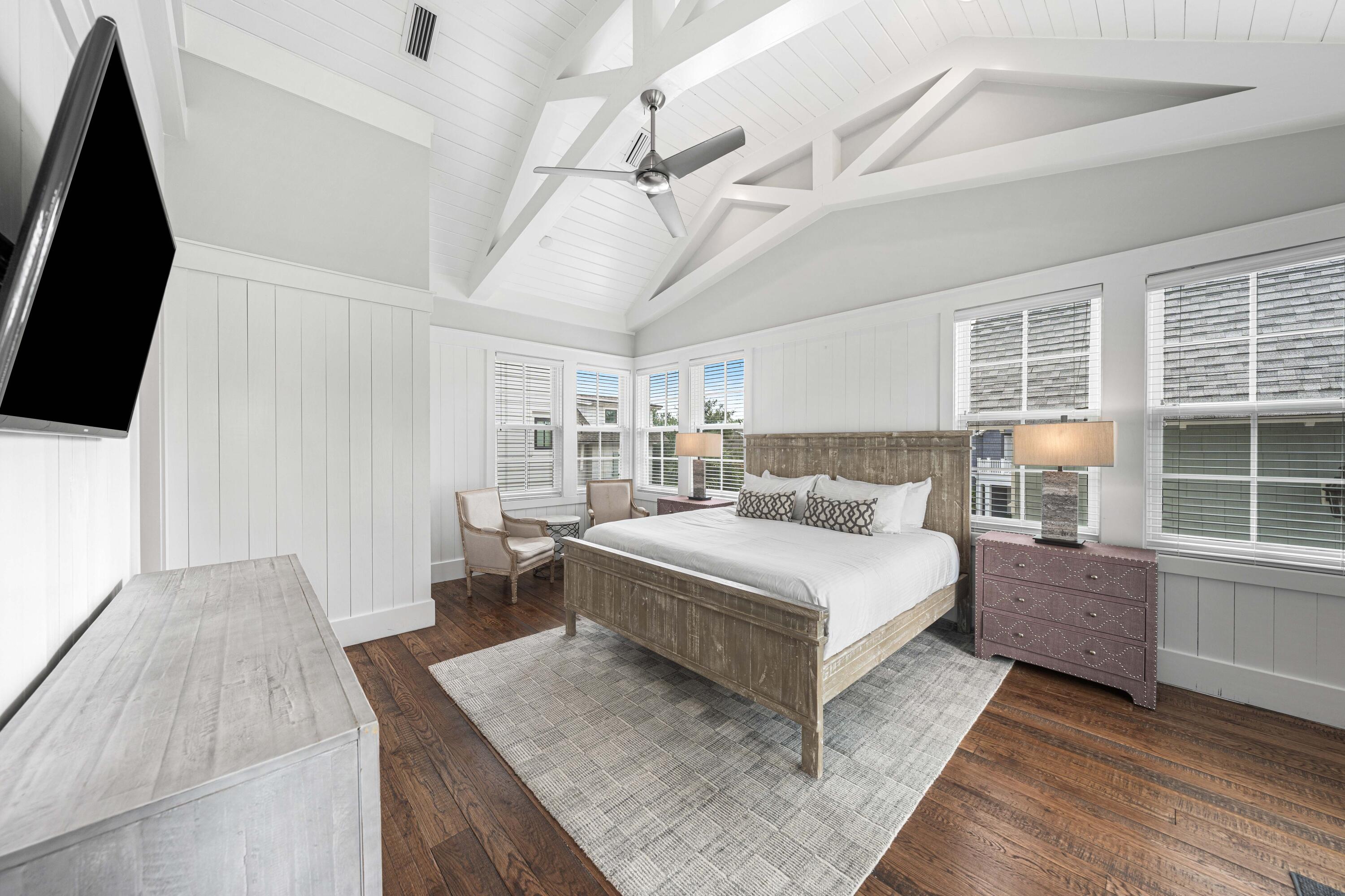 34 North Watch Tower Lane Inlet Beach, FL 32461 - Photo 51 of 90 a spacious bedroom with a bed and a flat tv screen on the dresser