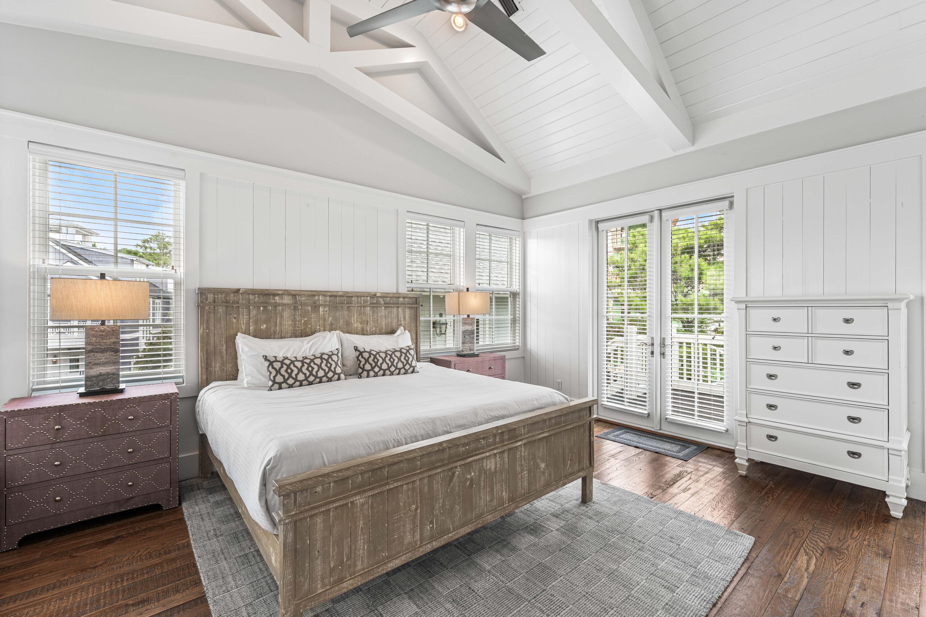 34 North Watch Tower Lane Inlet Beach, FL 32461 - Photo 53 of 90 a bedroom with a large bed and wooden floor