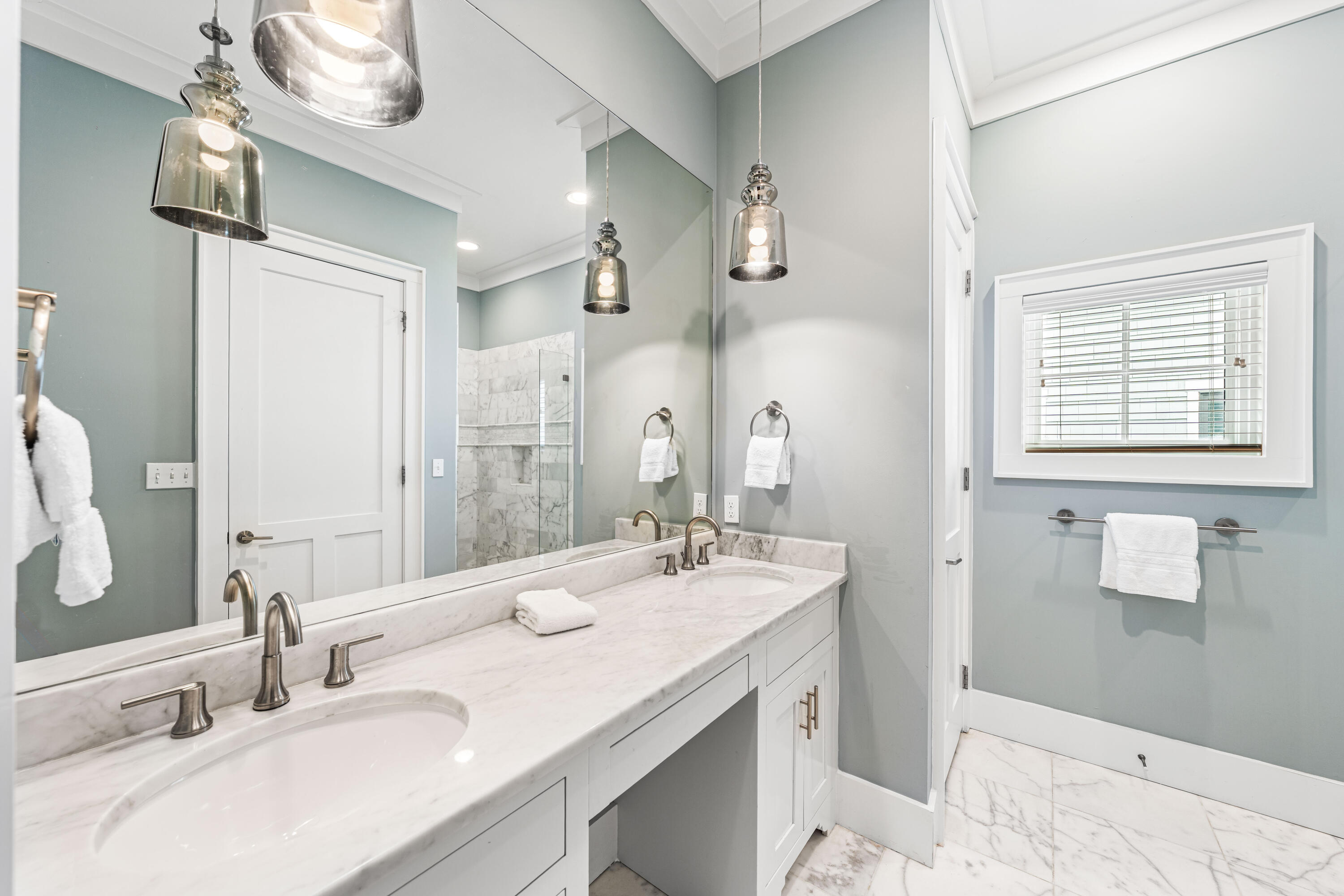 34 North Watch Tower Lane Inlet Beach, FL 32461 - Photo 55 of 90 a bathroom with a double vanity sink a mirror and a shower