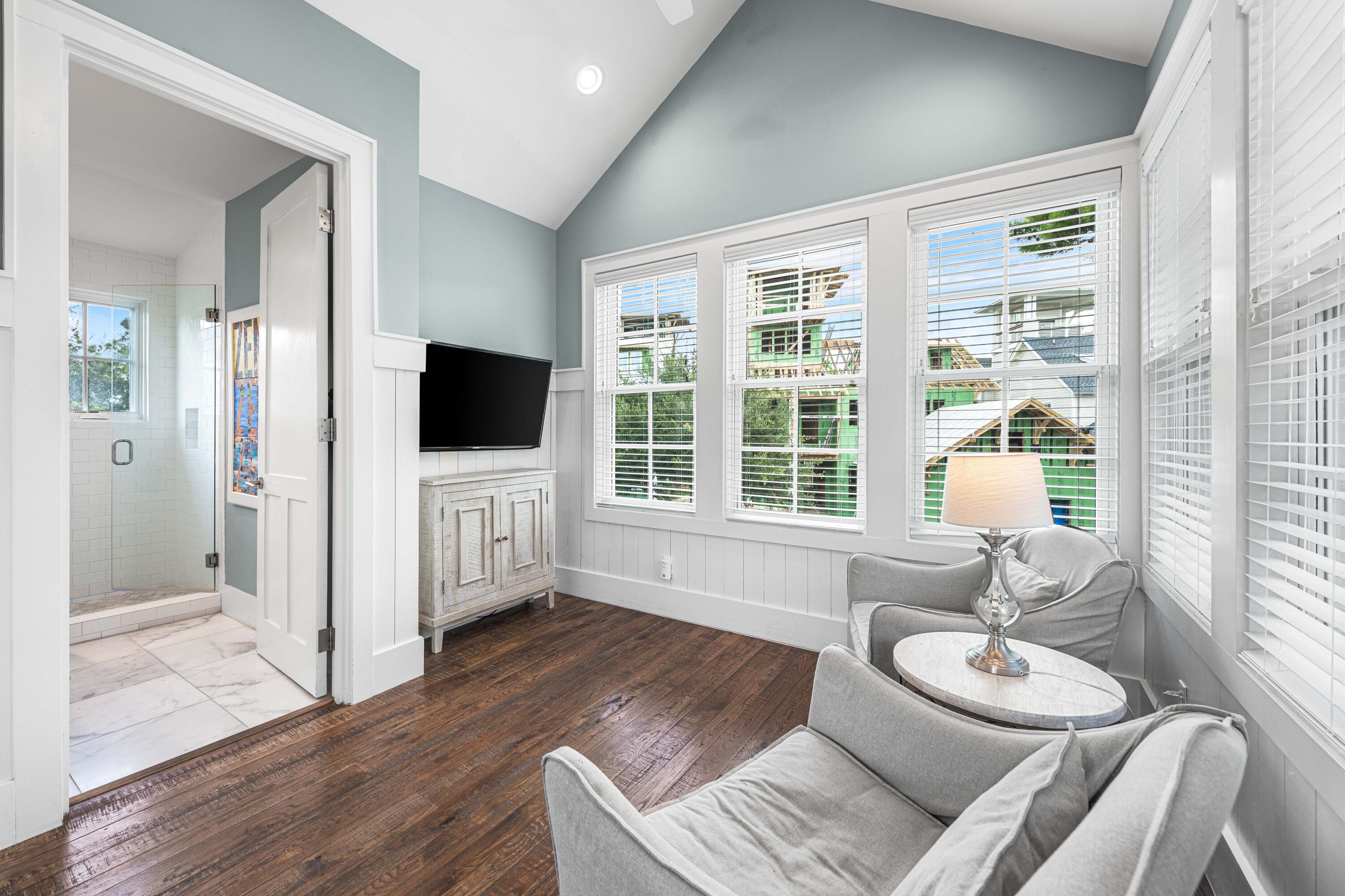 34 North Watch Tower Lane Inlet Beach, FL 32461 - Photo 57 of 90 a living room with furniture a flat screen tv and a large window