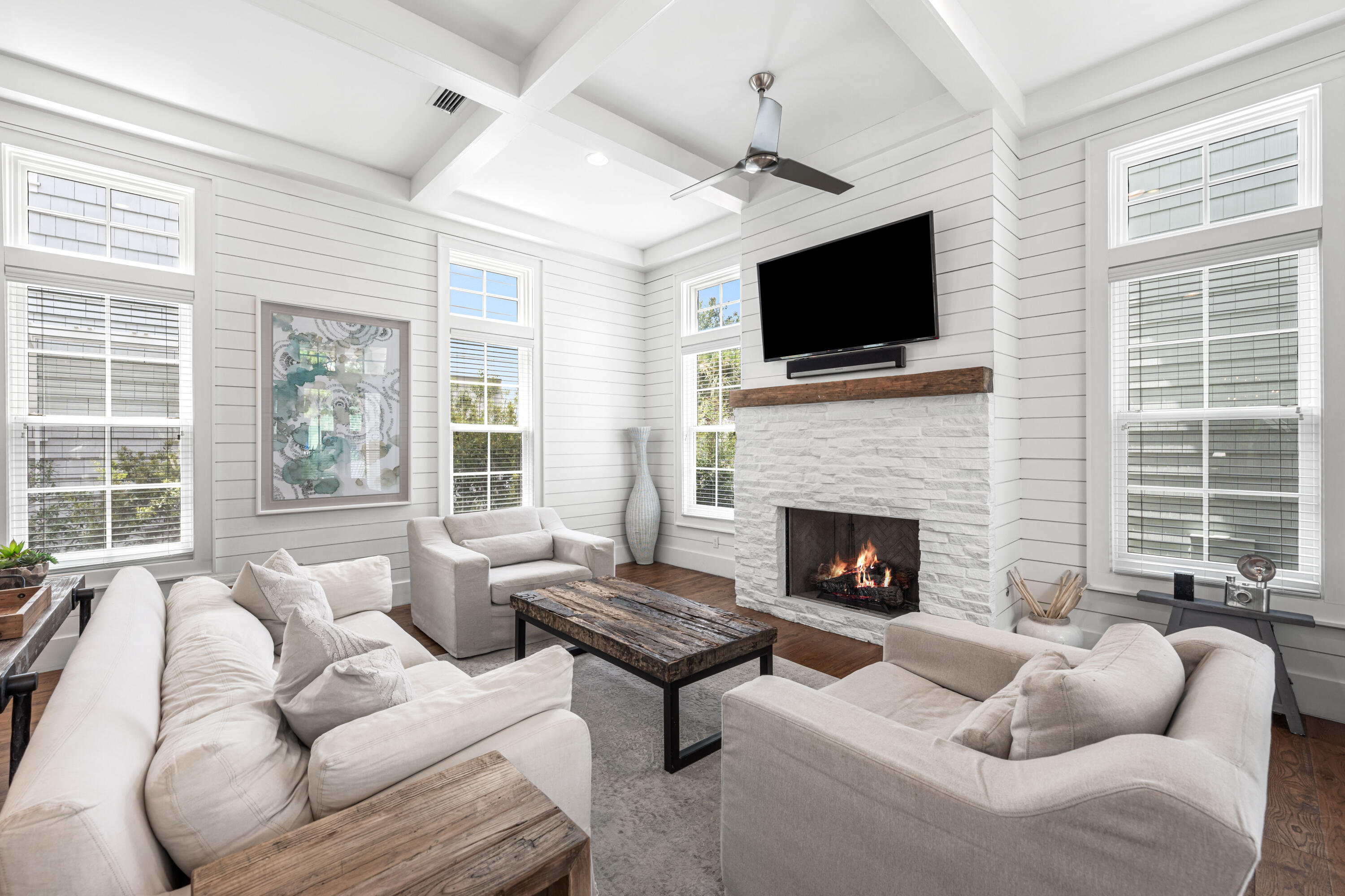 34 North Watch Tower Lane Inlet Beach, FL 32461 - Photo 6 of 90 a living room with furniture a flat screen tv and a fireplace