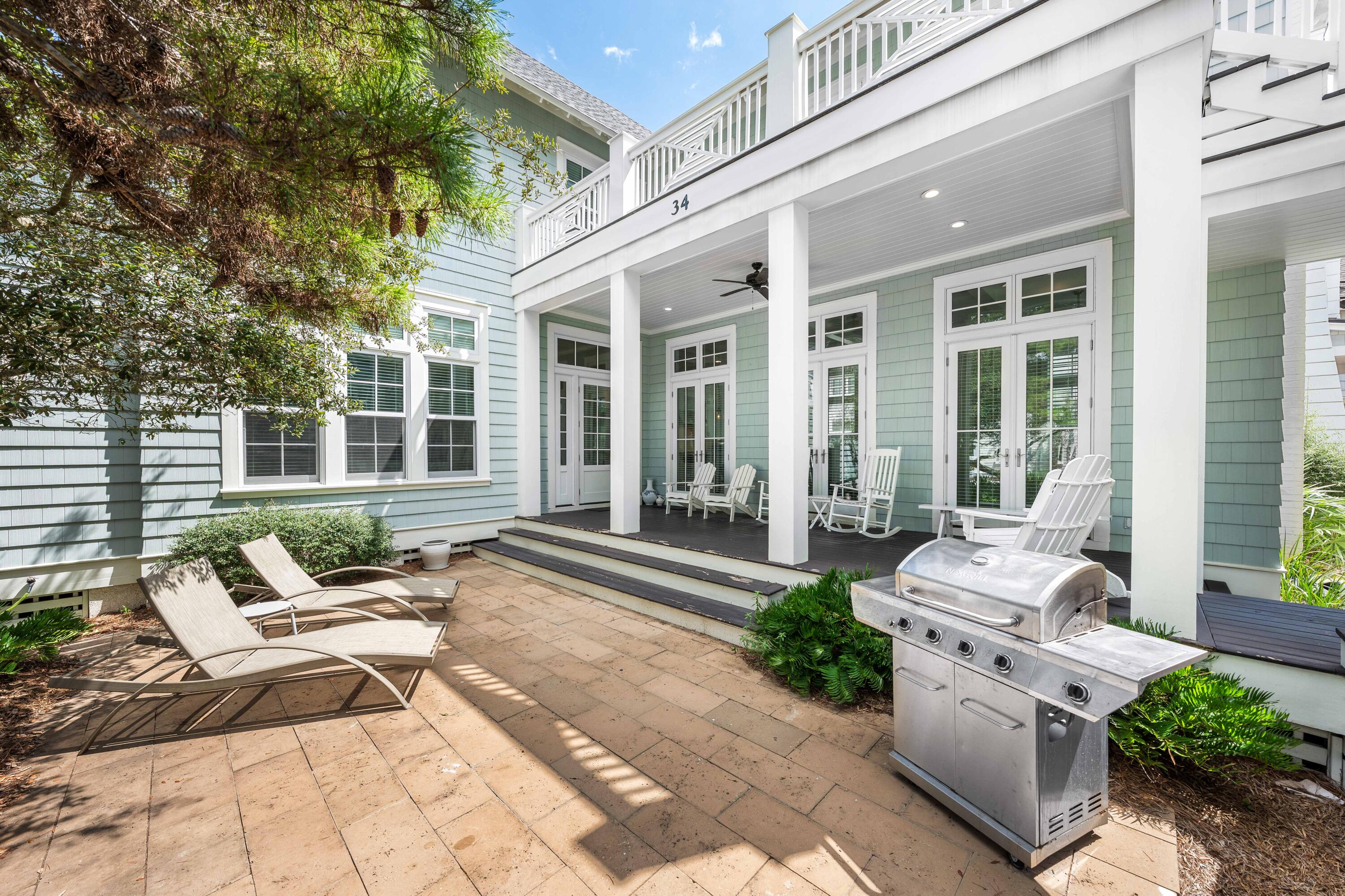 34 North Watch Tower Lane Inlet Beach, FL 32461 - Photo 70 of 90 a view of a patio with couches chairs and potted plants