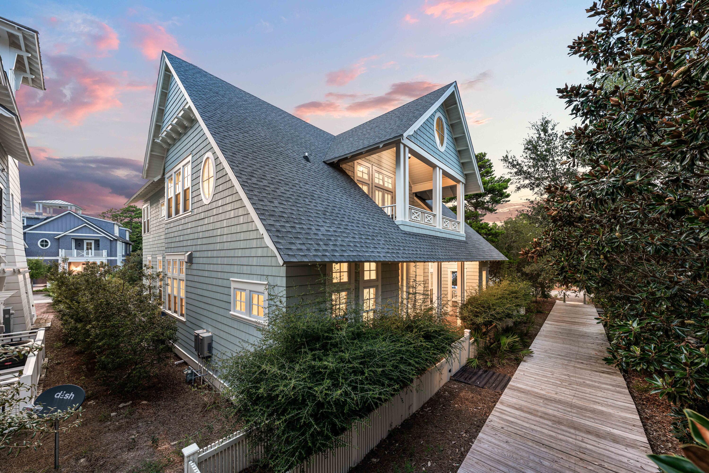 34 North Watch Tower Lane Inlet Beach, FL 32461 - Photo 81 of 90 a front view of a house with a yard and potted plants
