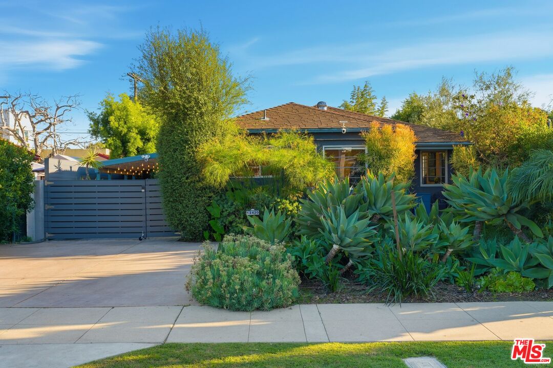 12420 Barbara Avenue Los Angeles, CA 90066 - Photo 1 of 40 a view of a house with a yard