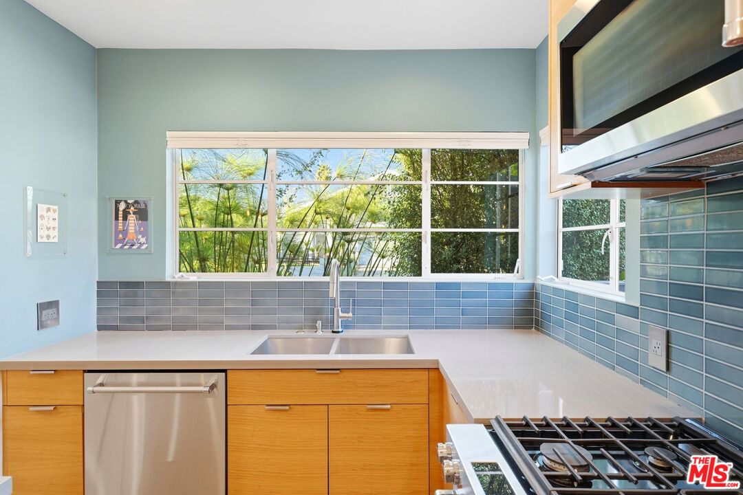 12420 Barbara Avenue Los Angeles, CA 90066 - Photo 13 of 40 a kitchen with a sink and a large window