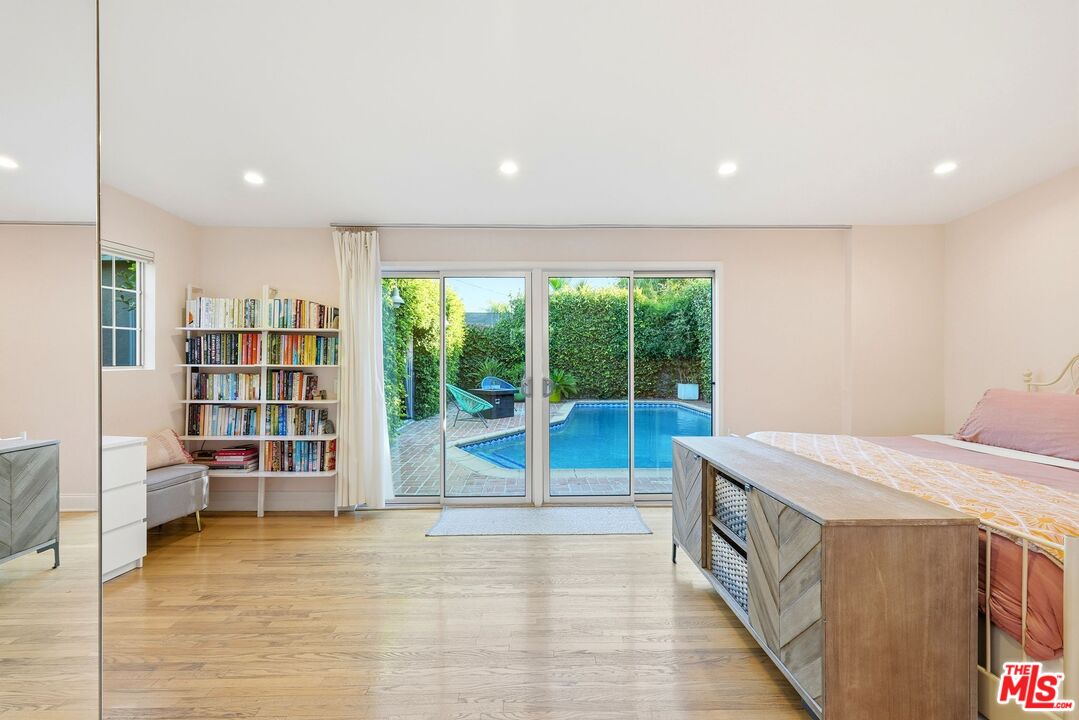 12420 Barbara Avenue Los Angeles, CA 90066 - Photo 16 of 40 a bed room with a bed and a book shelf