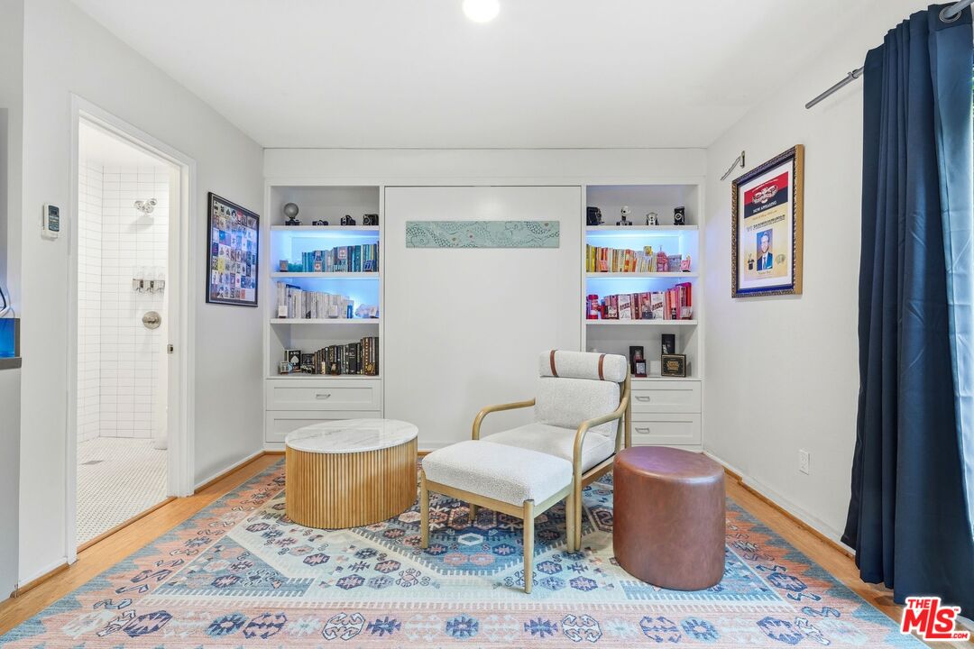 12420 Barbara Avenue Los Angeles, CA 90066 - Photo 24 of 40 a living room with furniture and a wooden floor