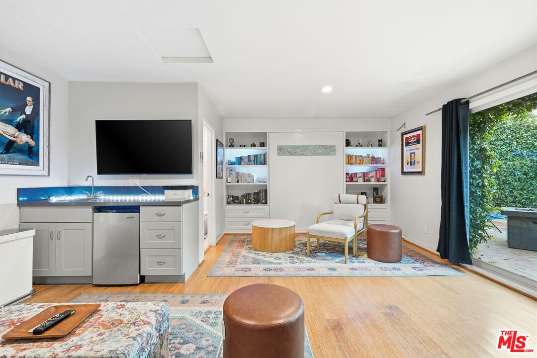 12420 Barbara Avenue Los Angeles, CA 90066 - Photo 25 of 40 a living room with furniture and a flat screen tv