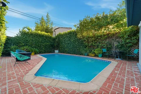 a view of a pathway both side of house