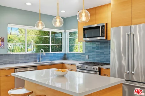 a kitchen with a stove and a microwave