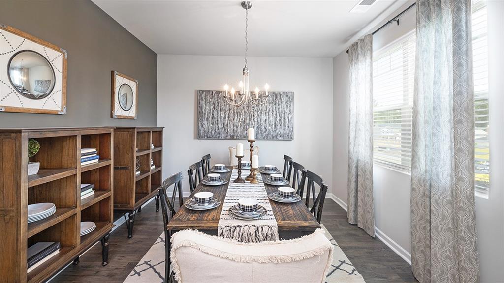 198 Aster Avenue Locust Grove, GA 30248 - Photo 22 of 42 a view of a dining room with furniture window and outside view
