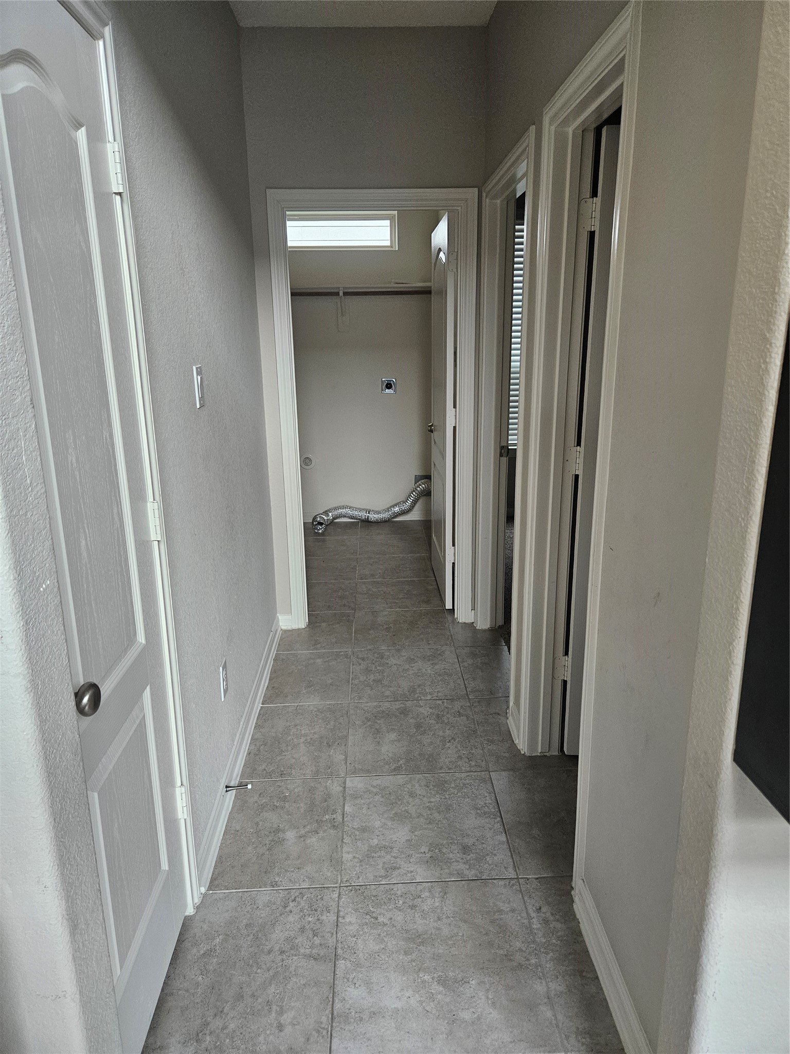 6411 Hunters Trace Lane Baytown, TX 77521 - Photo 12 of 23 View from the Family Living Area. Extended Hallway leads to Secondary Room, Washroom and Primary Closet.