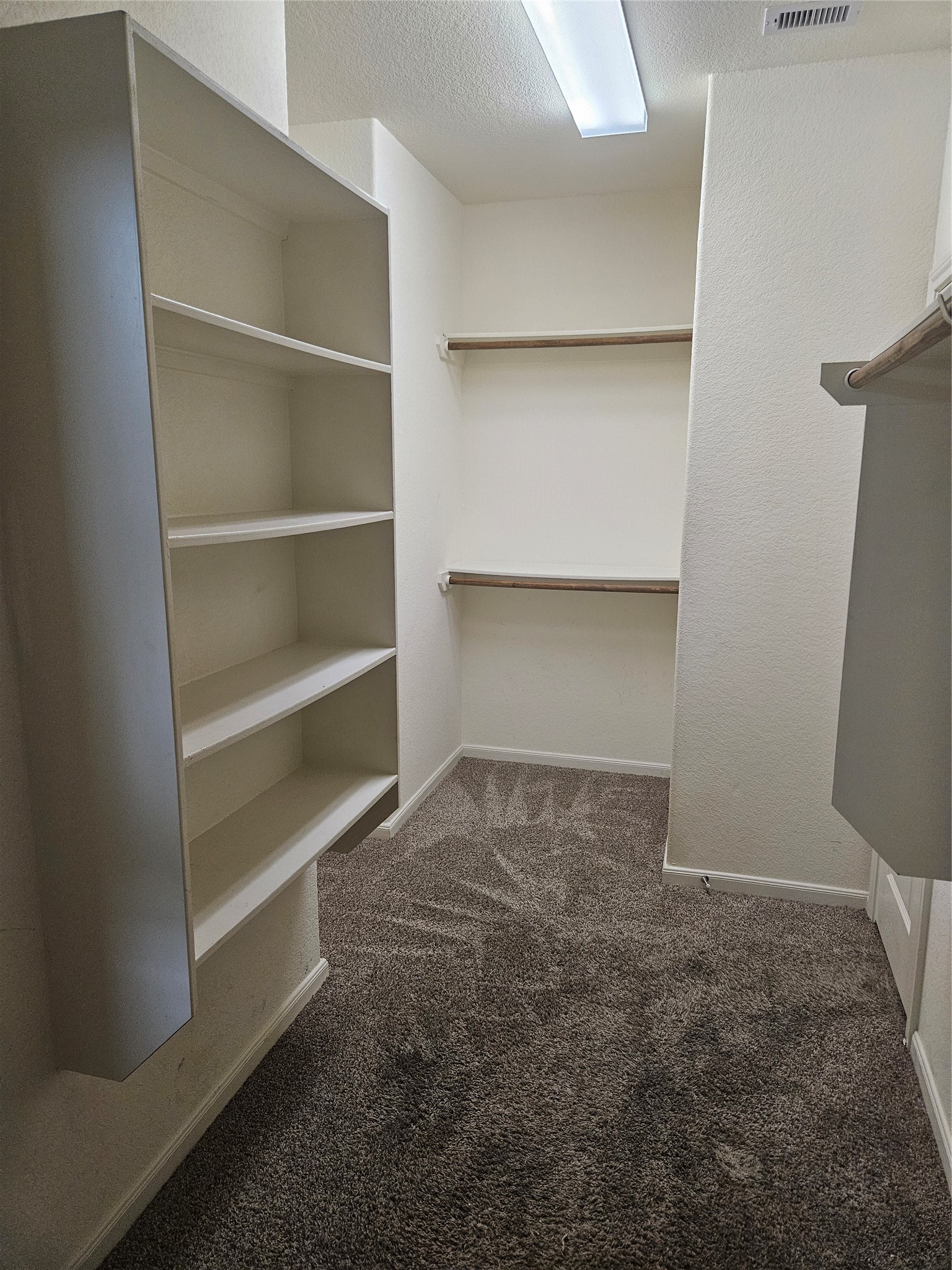 6411 Hunters Trace Lane Baytown, TX 77521 - Photo 13 of 23 Large walk in Closet leads to Primary Bedroom.