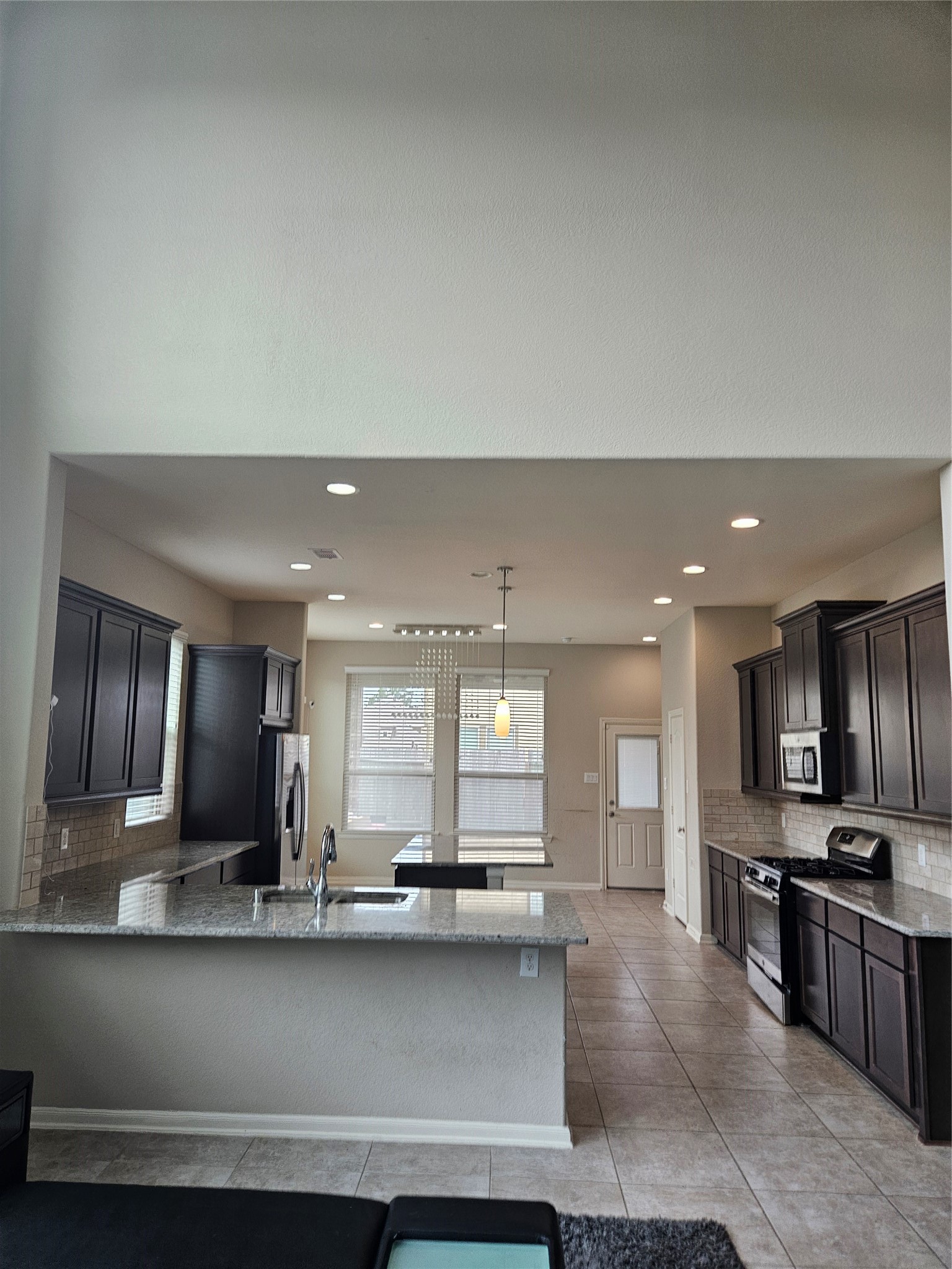 6411 Hunters Trace Lane Baytown, TX 77521 - Photo 6 of 23 View from the Family Living Area. Kitchen is open with a breakfast area and large island. Perfect for entertaining.