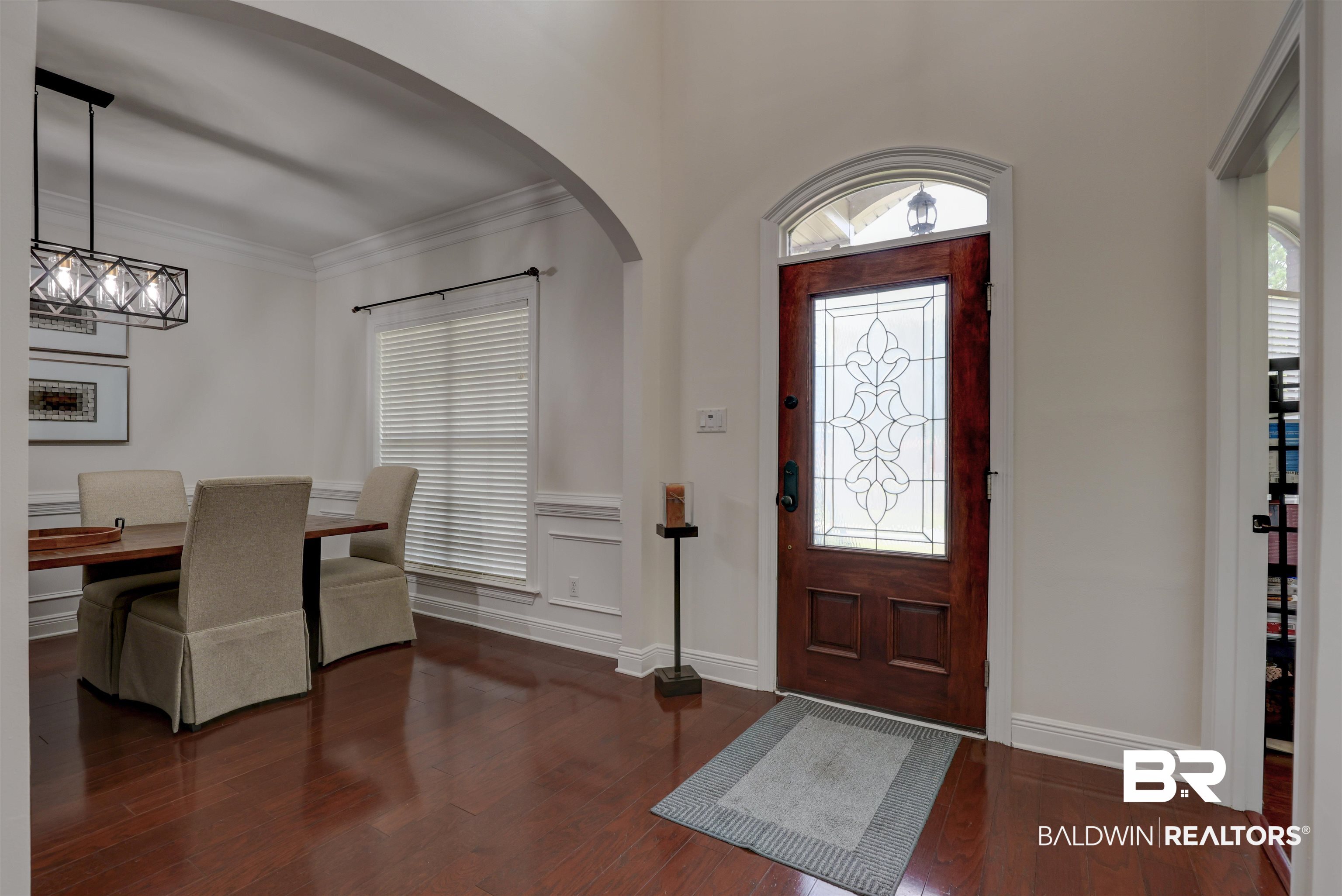 5565 Dawes Lane Theodore, AL 36582 - Photo 2 of 38 Entrance foyer featuring crown molding and dark hardwood / wood-style floors
