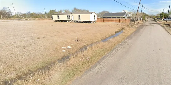 a view of residential houses with outdoor space and lake view