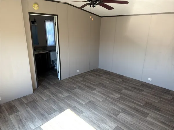 a view of a small space with wooden floor