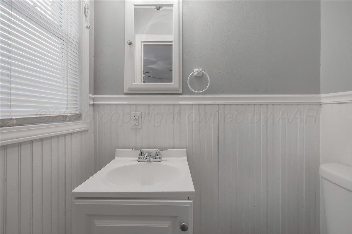 1415 Southwest 34th Avenue Amarillo, TX 79109 - Photo 12 of 22 a bathroom with a sink and vanity