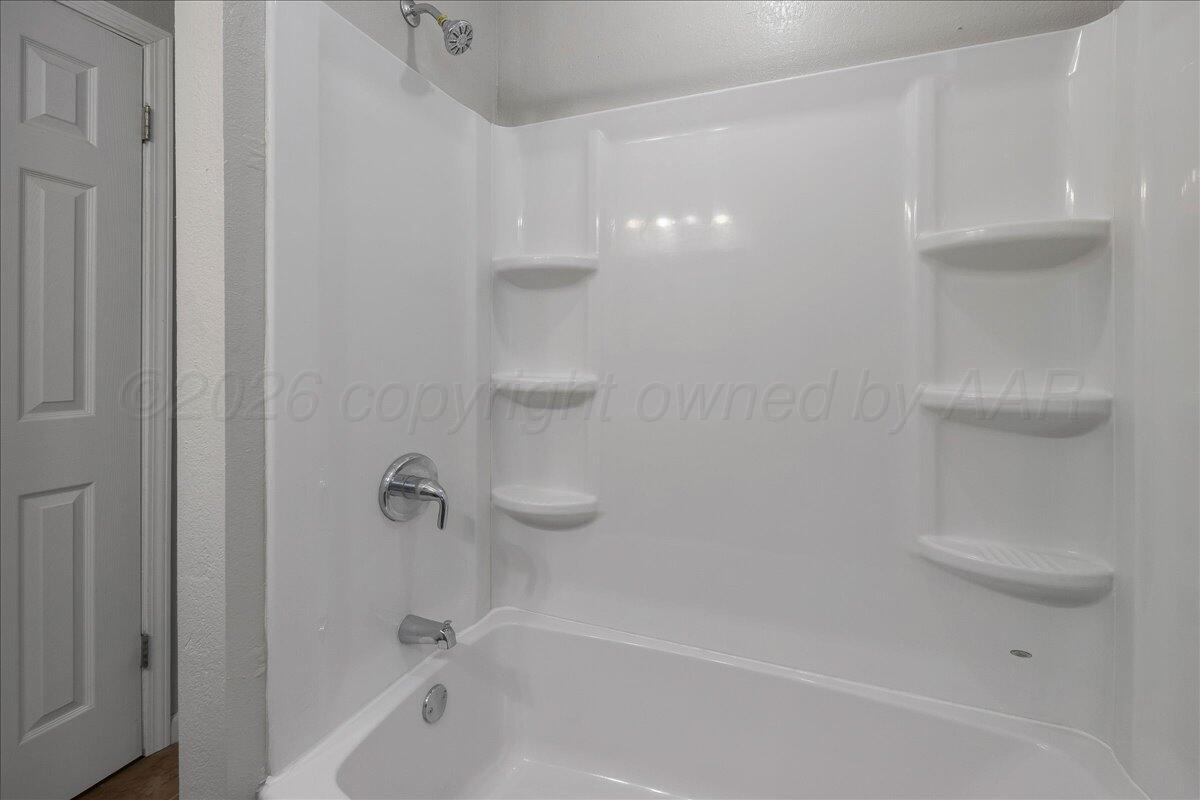 1415 Southwest 34th Avenue Amarillo, TX 79109 - Photo 17 of 22 a close view of a bathtub in a bathroom