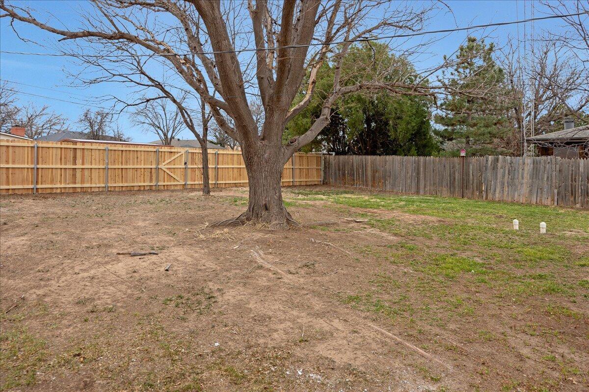 1415 Southwest 34th Avenue Amarillo, TX 79109 - Photo 21 of 22 a view of backyard with tree