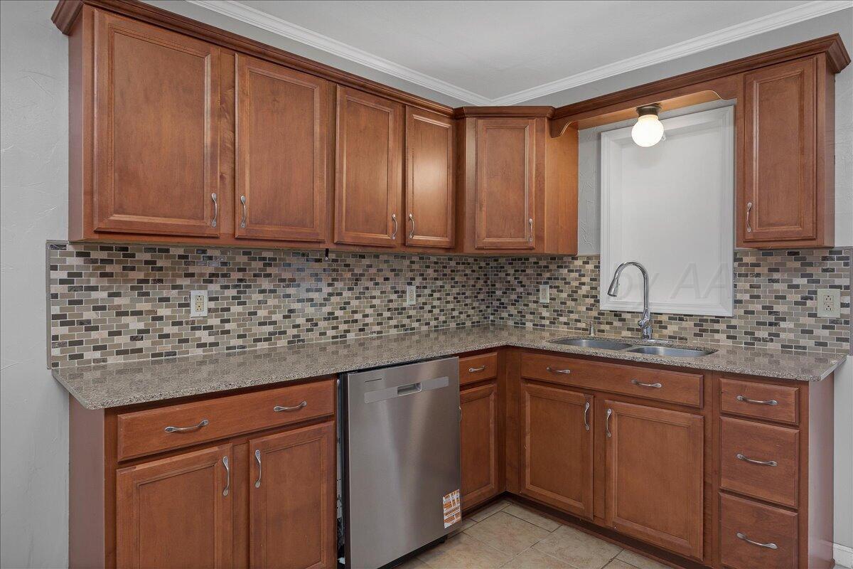 1415 Southwest 34th Avenue Amarillo, TX 79109 - Photo 8 of 22 a kitchen with stainless steel appliances granite countertop cabinets and sink