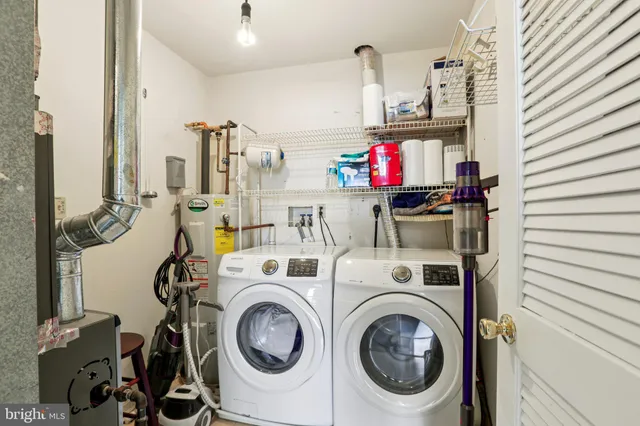 a view of washer and dryer in a utility room